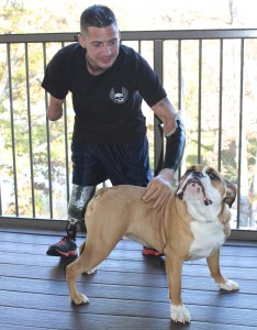 Marine combat veteran Todd Nicely and Xerxes on the deck of his home at the Lake of the Ozarks.