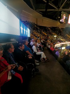Image shows people in wheelchairs and with other disabilities seated at an ADA section at the RNC