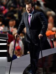 Brock Mealer walks onto the RNC stage using two canes