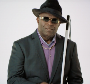 A blind man holding a walking stick who was featured in the video for Indiana's new campaign on disability awareness