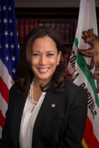 head shot of Kamala Harris in front of the U.S. and C.A. flags