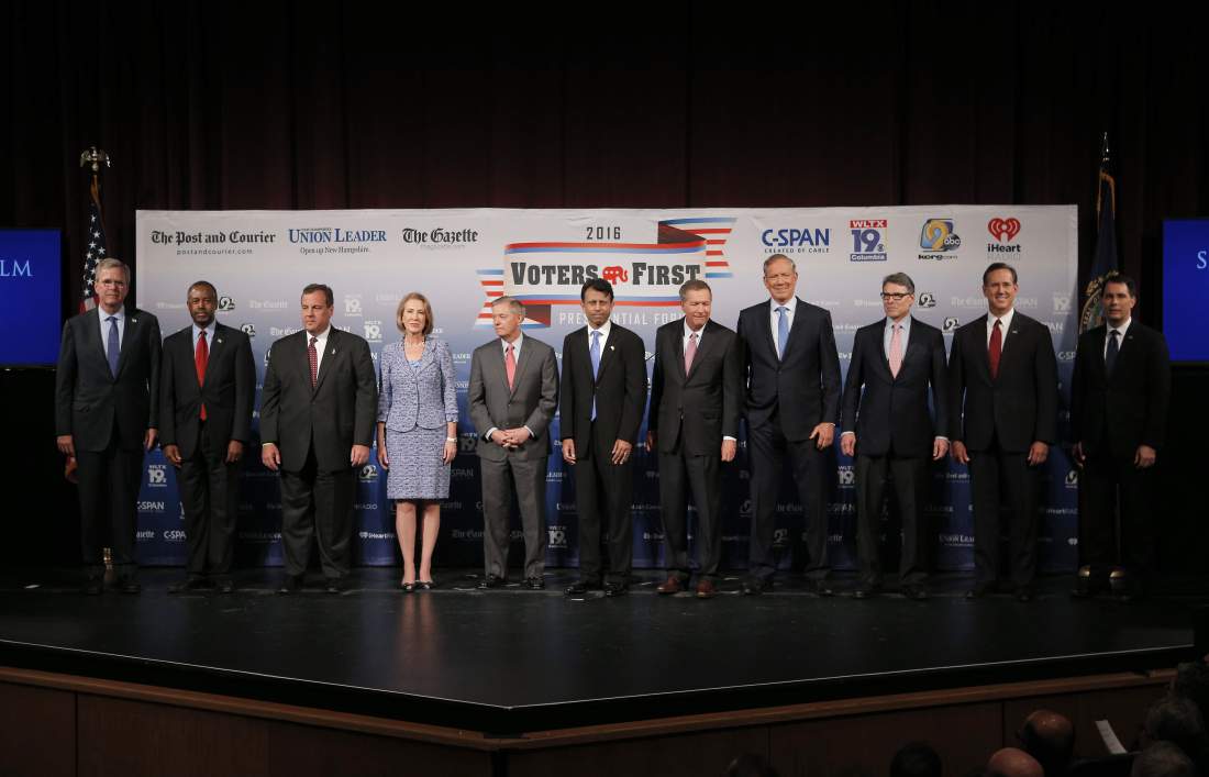 Eleven of the declared 2016 Republican U.S. presidential candidates, including (L-R) Florida Gov. Jeb Bush, Dr. Ben Carson, New Jersey Governor Chris Christie, former Hewlett-Packard CEO Carly Fiorina, U.S. Senator Lindsey Graham, Louisiana Governor Bobby Jindal, Ohio Governor John Kasich, former New York Governor George Pataki, former Texas Governor Rick Perry, former U.S. Senator Rick Santorum and Wisconsin Governor Scott Walker, pose together on stage before the start of the the Voters First Presidential Forum in Manchester, New Hampshire, August 3, 2015. REUTERS/Brian Snyder - RTX1MX1K