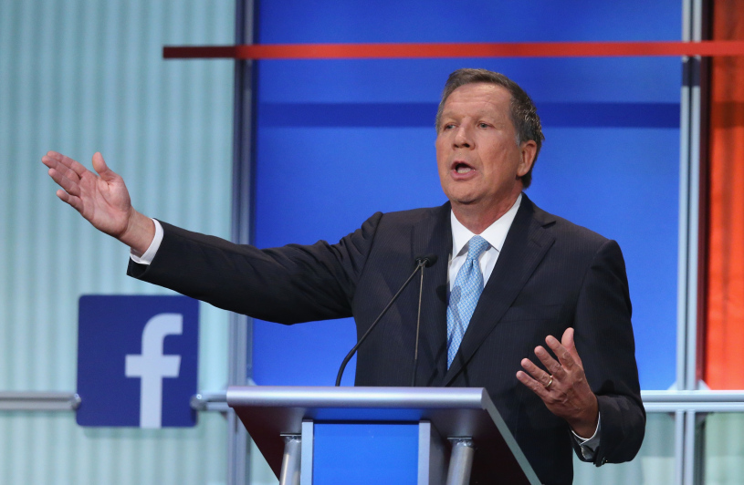 CLEVELAND, OH - AUGUST 06: Republican presidential candidate Ohio Gov. John Kasich fields a question during the first Republican presidential debate hosted by Fox News and Facebook at the Quicken Loans Arena on August 6, 2015 in Cleveland, Ohio. The top ten GOP candidates were selected to participate in the debate based on their rank in an average of the five most recent political polls. (Photo by Scott Olson/Getty Images)