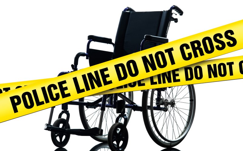 Image: Police caution tape in front of a wheelchair