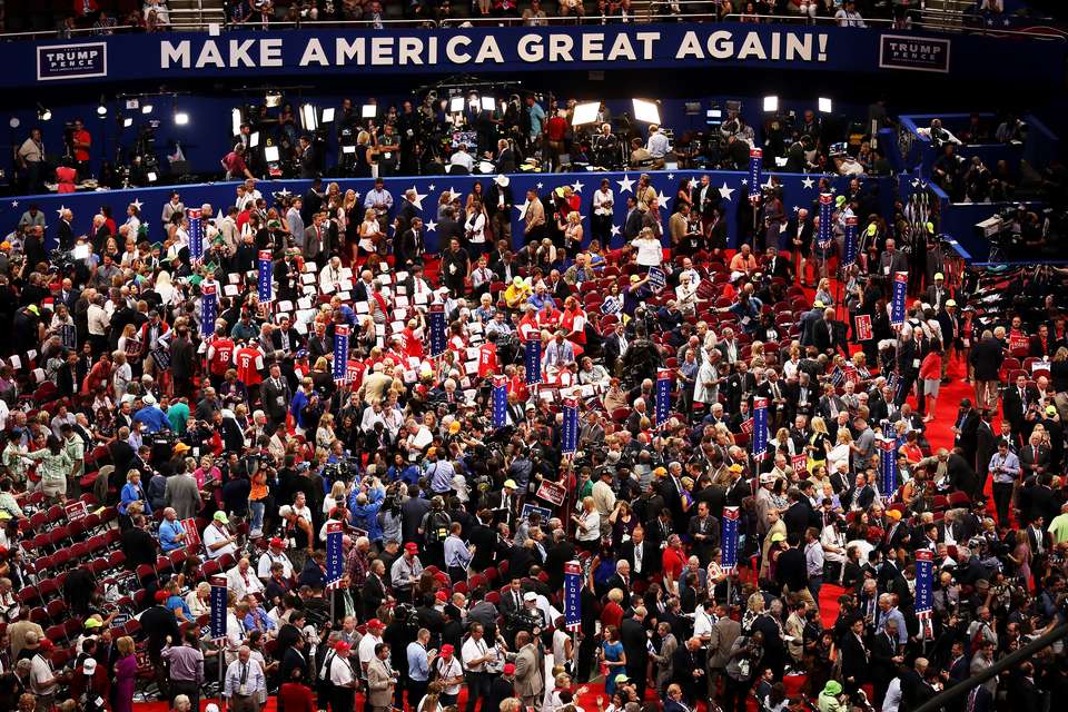 crowd shot of RNC with sign in back saying "Make America Great Again"