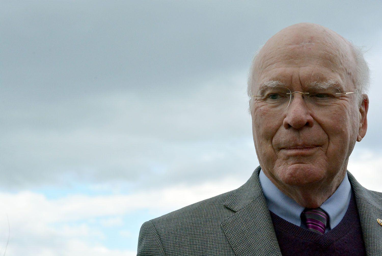Patrick Leahy standing outside with clouds in the background