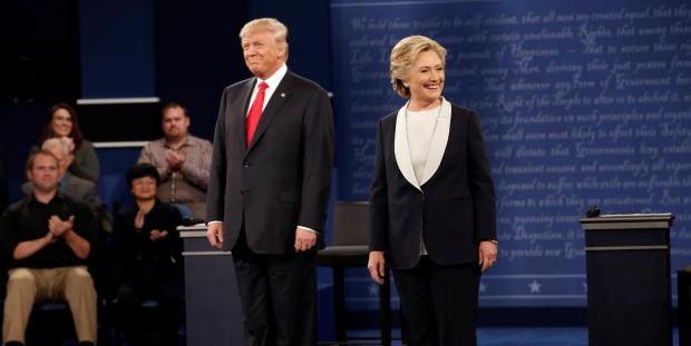 Republican U.S. presidential nominee Donald Trump and Democratic U.S. presidential nominee Hillary Clinton appear together during their presidential town hall debate at Washington University in St. Louis, Missouri, U.S., October 9, 2016. REUTERS/Mike Segar - RTSRIKQ