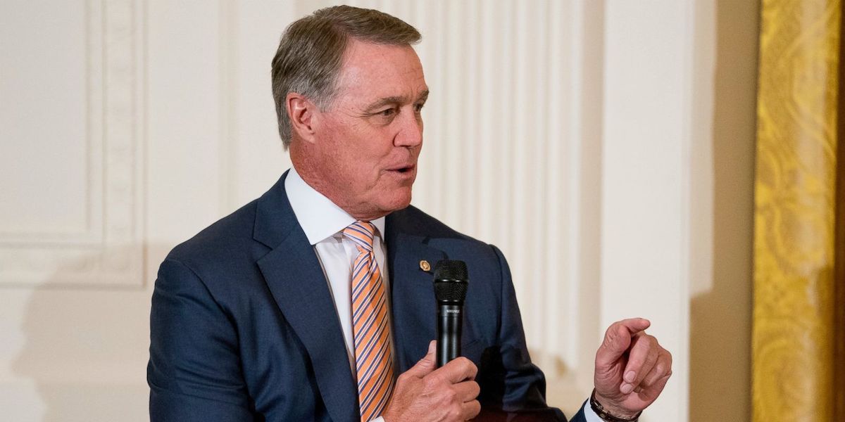 David Perdue speaking into a microphone at an event