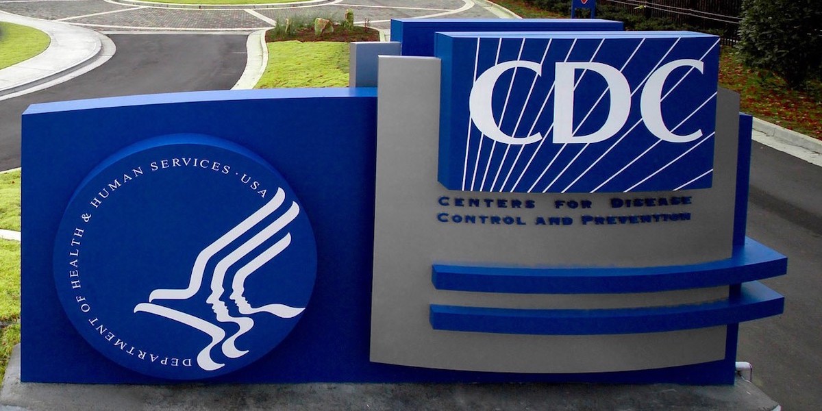 Sign outside a CDC building with the logo of the agency on it