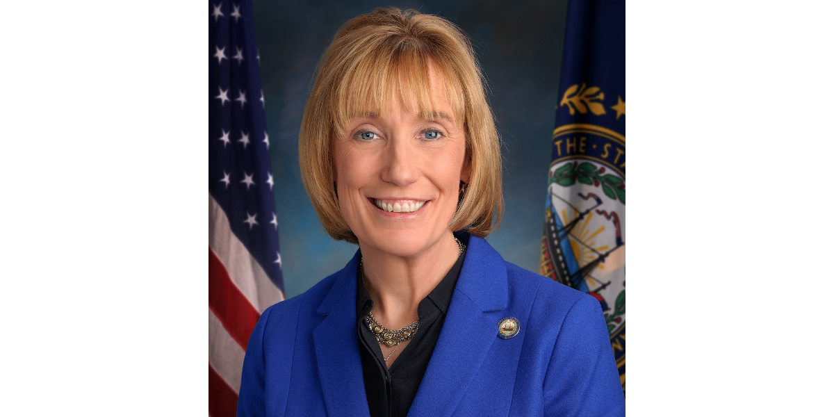 Senator Maggie Hassan official portrait, smiling wearing a blue suit