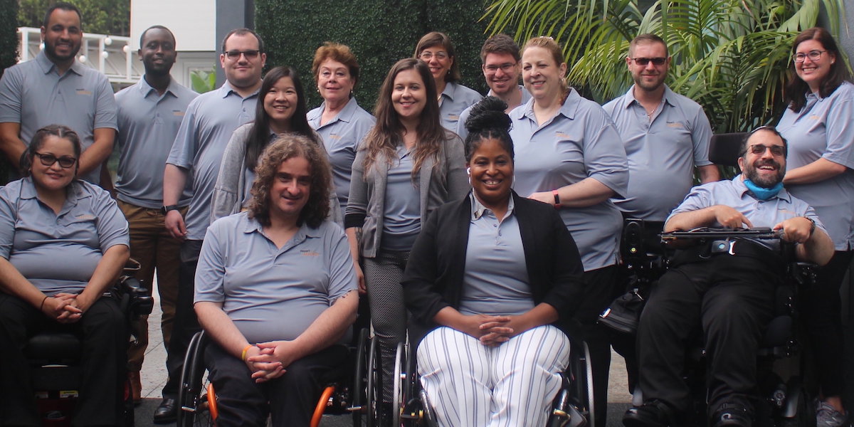 RespectAbility staff as of Summer 2021 smile together wearing polo shirts with the RespectAbility logo on them